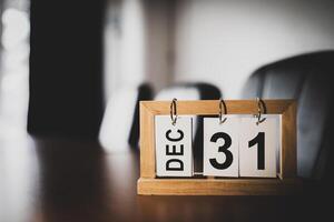 December calendar page. 31st day of New Year's Eve in the office room. with copy space and business design Planning concepts, setting new strategic goals photo