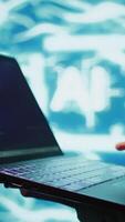 Vertical Engineer using notebook to maintenance artificial intelligence neural networks. Close up shot of IT expert using AI system aiding in processing and transmitting information, camera B video