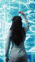 Vertical Engineers use VR headset and AI neural networks modeled after human brain to solve complex problems. IT experts using artificial intelligence and virtual reality tech to look at data, camera B video