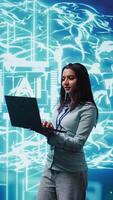 Vertical Technician using laptop to maintenance artificial intelligence neural networks made up of interconnected nodes layers. Admin using AI system aiding in processing and transmitting information, camera B video