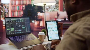 Professional software developer at desk working on AI coding and machine learning projects, showcasing innovation in software development and digital business. Internet of things. Camera B. video