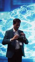 Vertical Engineers use VR smart goggles and AI neural networks to solve company problems. IT experts using artificial intelligence and AR virtual reality tech to visualize startup business data, camera B video