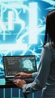 Vertical AI specialist reviews data charts, emphasizing importance of data driven decision making in tech industry. Engineer developing innovative artificial intelligence solutions for startup, camera A video