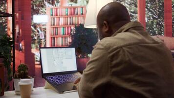 Professional entrepreneur examining blueprints and using digital tools for office space planning and development. Business owner workspace design for renting, investment strategy. Camera B. video