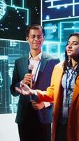 Vertical Presenter and specialist guest talking at AI summit bringing together tech startups professionals, exploring latest developments in artificial intelligence and deep learning technology, camera B video