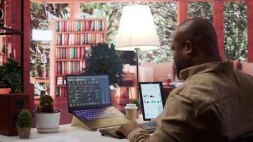 AI software engineer coding modern innovative development project on his gadgets, showcasing machine learning and data processing on neural network. Artificial intelligence business. Camera B. video