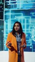 Vertical Tech company CEO using conference as platform to present latest AI services. Woman uses microphone to talk at convention with business investors interested in artificial intelligence, camera B video