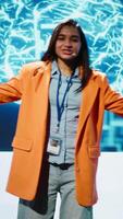 Vertical Lively speaker talks at AI event gathering tech startups managers, investors and academics. Expert hosts sessions geared towards helping IT business leaders tap into artificial intelligence, camera A video