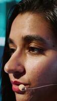 Vertical AI expert showcasing new cutting edge technologies, discussing industry advancements. Extreme close up of woman sharing latest developments in AI and Big Data industries, camera A video