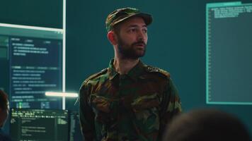 Government military hackers engaged in hybrid warfare strategies. Using sophisticated software and technology to secure information, prevent breaches and protect military operations. Camera A. video
