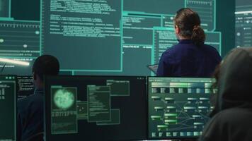 Happy cheerful hackers team gaining access inside network systems, celebrating their achievement and the step forward during hybrid war activities. Pleased experts stealing database info. Camera A. video