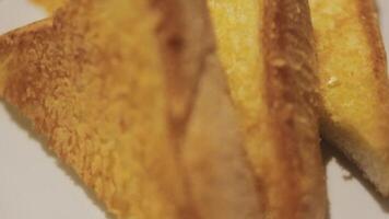 Fresh crusty buttered rye bread slices sprinkled with chopped parsley and garnished with a butter curl video