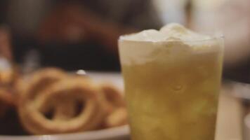 Beer. Glass of fresh and cold beer on a wooden table. Craft beer. Shallow depth of field. Copy space. video