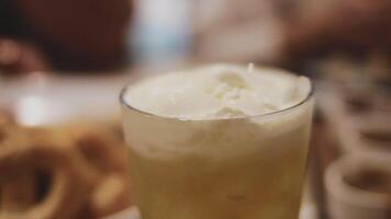 Beer. Glass of fresh and cold beer on a wooden table. Craft beer. Shallow depth of field. Copy space. video