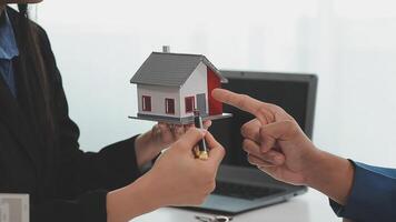 Sale representative offer house purchase contract to buy a house or apartment or discussing about loans and interest rates video