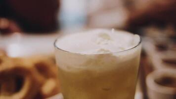 Beer. Glass of fresh and cold beer on a wooden table. Craft beer. Shallow depth of field. Copy space. video