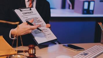 Judge gavel with Justice lawyers having team meeting at law firm background. Concepts of Law and Legal services. video