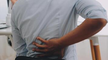 Orthopedists holding digital tablet and pointing at model. Concept of osteoporosis, back pain, lumbar, chiropractic and health. video