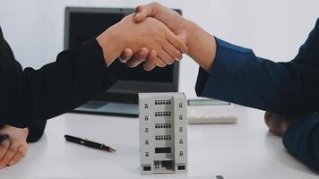 Estate agent shaking hands with customer after contract signature video