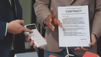 Estate agent are presenting home loan and giving house to client after discussing and signing agreement contract with approved application form, Home Insurance and Real estate investment concept. video