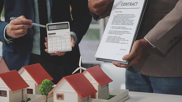 Estate agent are presenting home loan and giving house to client after discussing and signing agreement contract with approved application form, Home Insurance and Real estate investment concept. video