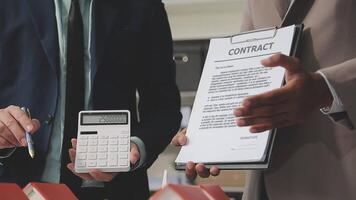 Estate agent are presenting home loan and giving house to client after discussing and signing agreement contract with approved application form, Home Insurance and Real estate investment concept. video