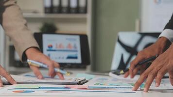 Business meeting time,business account managers crew working with new startup project,report analysis cost graph on desk at meeting room. video