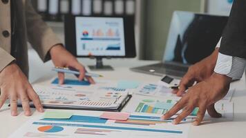 Business meeting time,business account managers crew working with new startup project,report analysis cost graph on desk at meeting room. video