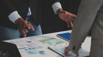 Business meeting time,business account managers crew working with new startup project,report analysis cost graph on desk at meeting room. video