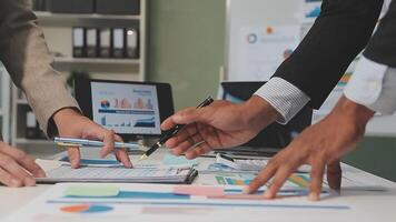 Business meeting time,business account managers crew working with new startup project,report analysis cost graph on desk at meeting room. video