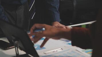 Business meeting time,business account managers crew working with new startup project,report analysis cost graph on desk at meeting room. video
