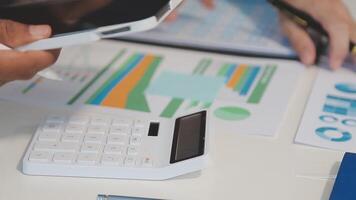 Business meeting time,business account managers crew working with new startup project,report analysis cost graph on desk at meeting room. video