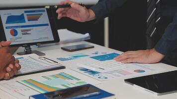 Business meeting time,business account managers crew working with new startup project,report analysis cost graph on desk at meeting room. video