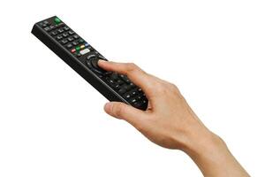 Asian woman use finger of left hand to press button on television remote control isolated on white background with clipping path. photo