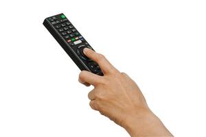 Asian woman use finger of left hand to press button on television remote control isolated on white background with clipping path. photo