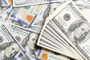 heap of US Dollar bills, money background. Top view of business concept on background with copy space photo