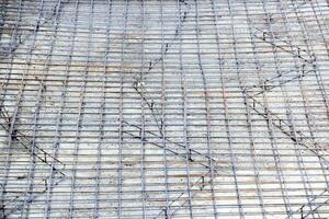 Background of reinforcing steel bars for building armature. Steel reinforcement in the construction of the building photo