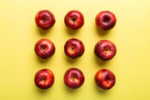 Many red apples on colored background, top view. Autumn pattern with fresh apple above view photo