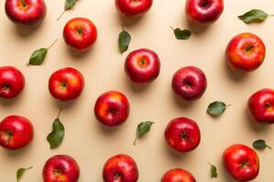 Many red apples on colored background, top view. Autumn pattern with fresh apple above view photo