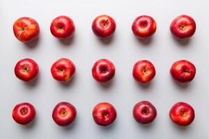 Many red apples on colored background, top view. Autumn pattern with fresh apple above view photo