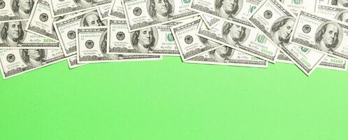 dollar bills a on a light colored background. copy space, top view business concept photo