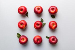 Many red apples on colored background, top view. Autumn pattern with fresh apple above view with copy space for design or text photo