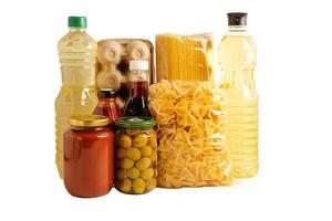 Foodstuffs in donation box isolated on white background with clipping path for volunteer to help people. photo