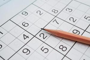 Sudoku puzzle, game to play for keep you brain younger for developing Alzheimer disease in senior patient. photo