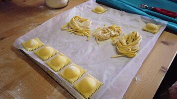 A person forms nests of handmade tagliatelle in the traditional way. video