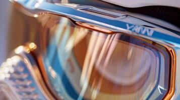 An upclose look at the frame of the goggles with a glossy metallic finish and subtle branding embossed on the side photo