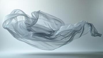 A magical and surreal image captured with a flowing fabric floating in midair suspended by the studio lighting photo