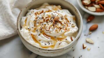 A bowl of creamy Greek yogurt topped with a drizzle of lavenderinfused honey and a handful of toasted almonds photo
