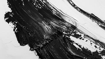 The simplicity of black and white is elevated in this abstract depiction of paint strokes allowing the texture and form to take center stage. Black and white art. photo