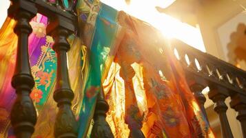 A vibrant sari gracefully d over the railings of a balcony as if it were dancing in the wind photo